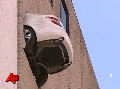 Car Dangles From Parking Garage